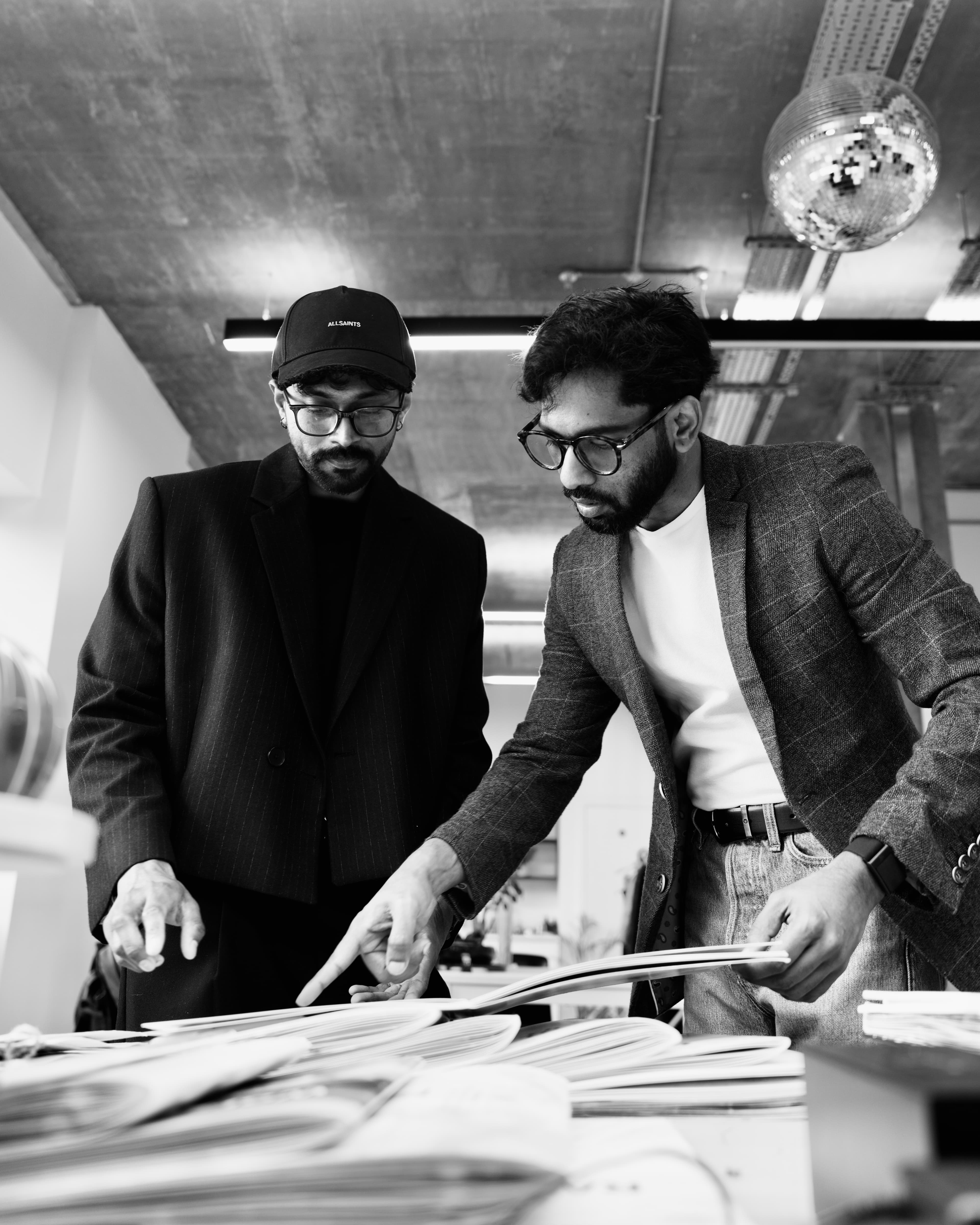 Vamsi Sivalanka and Akhilesh Karni reviewing design work